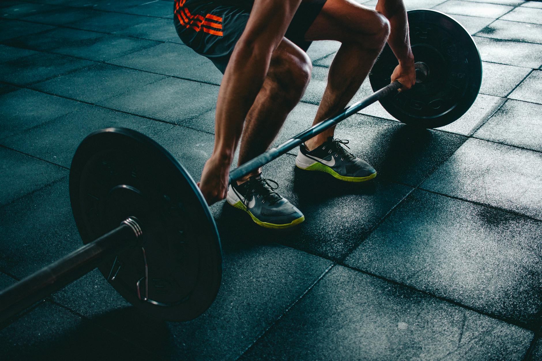 https://www.pexels.com/photo/person-holding-barbell-841130/